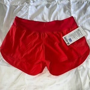 Speed up mid rise short 4” lined in carnation red